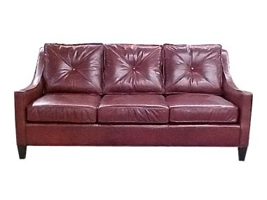 A dark red sofa with 3 cushions, from McKinley Leather. 